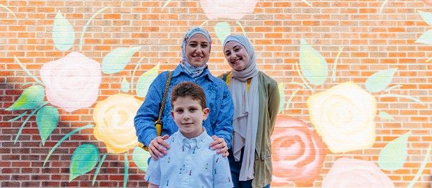 Family in front of Mural at Liberty Center